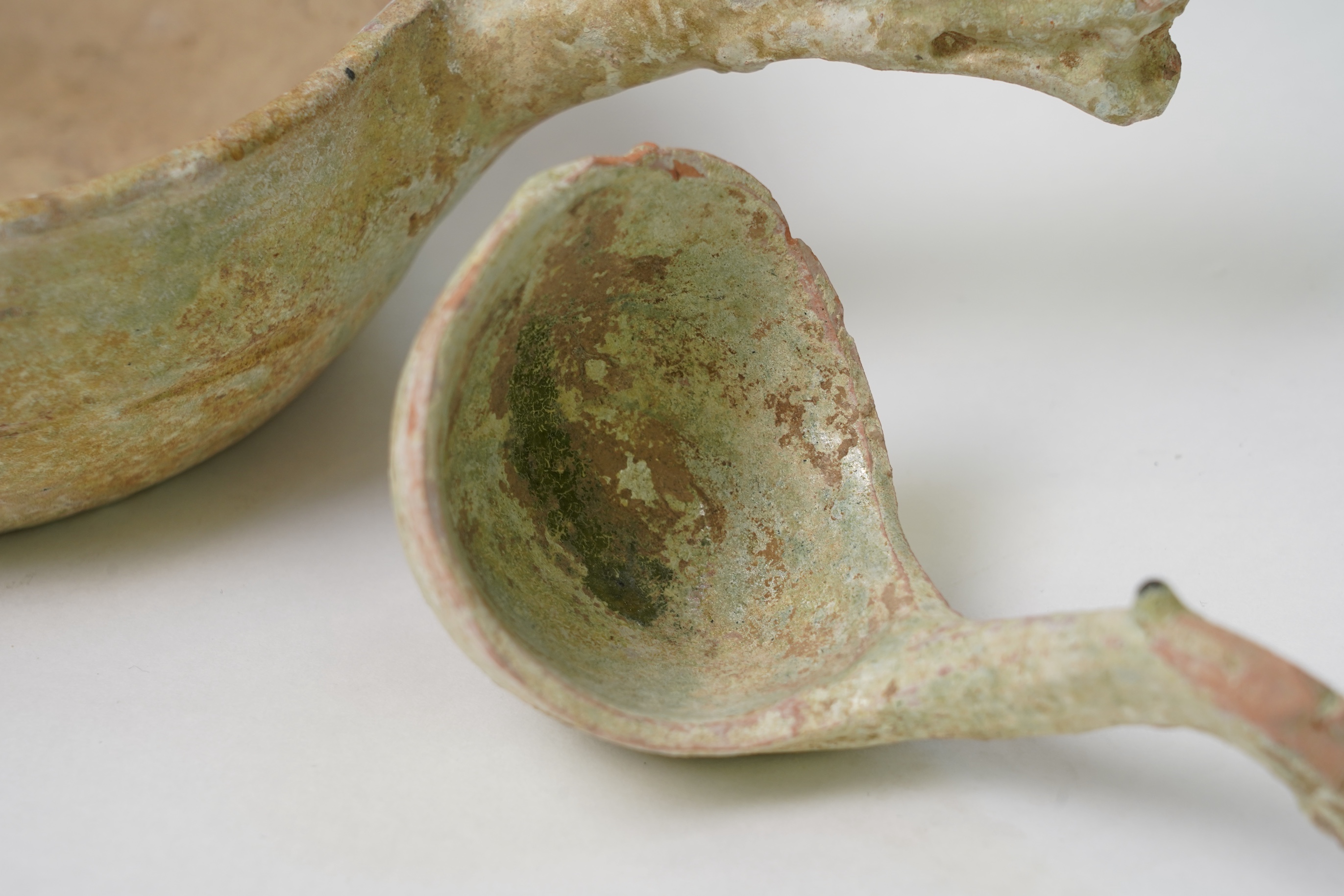 A Chinese earthenware scoop and a similar ladle, Han Dynasty (1st-2nd century A.D.)
